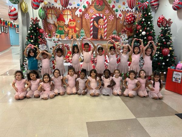 Ballerinas posing at the holiday gingerbread performance
